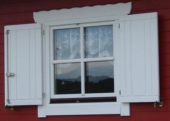 Wooden house shutters